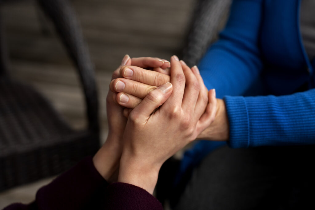 hands holding each other for support